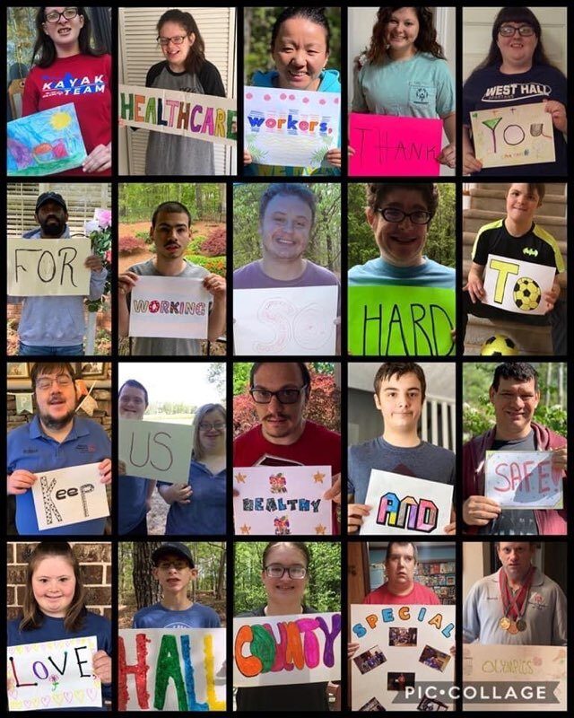 Athletes holding thank-you signs for healthcare workers